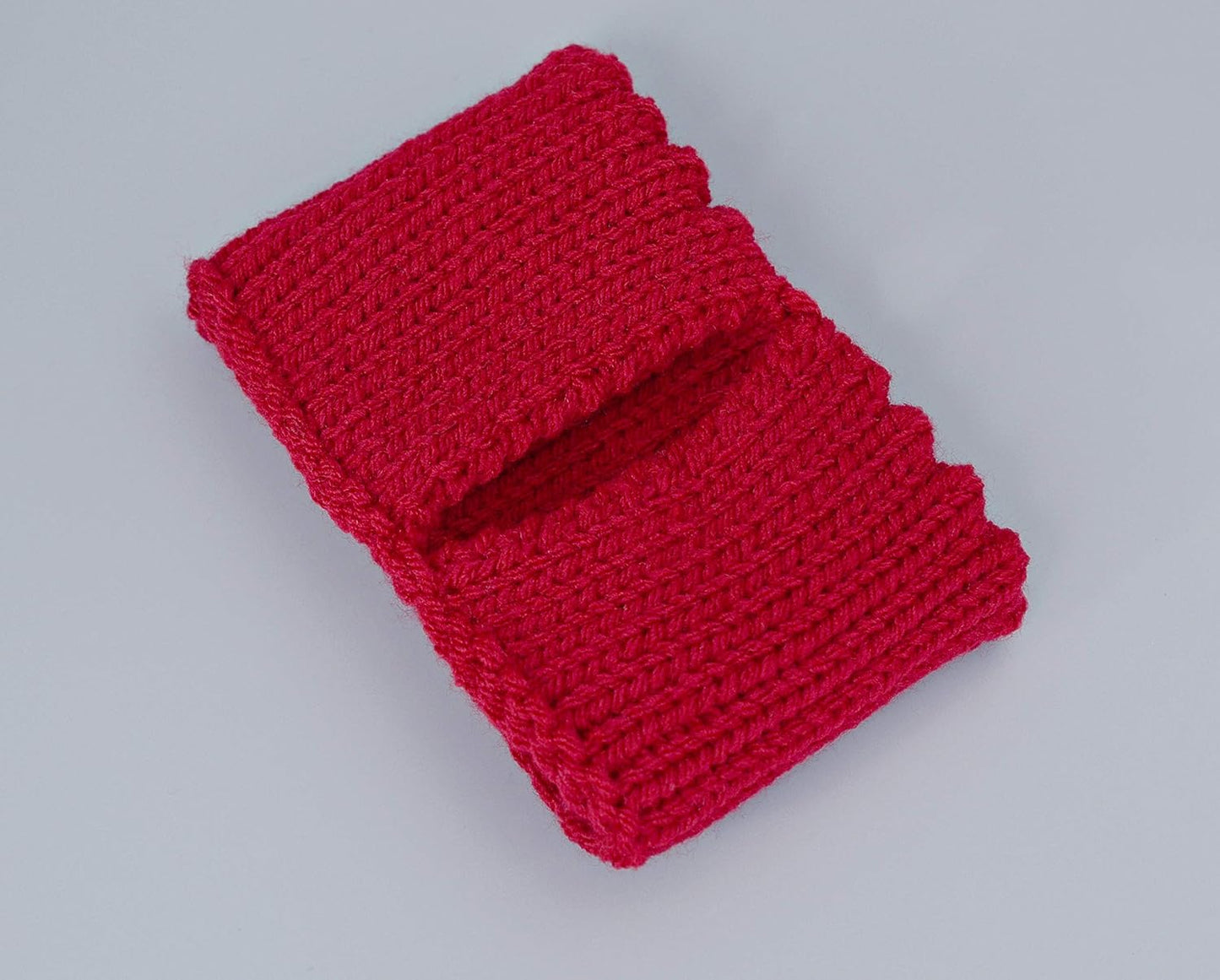 Red knitted mug cozy