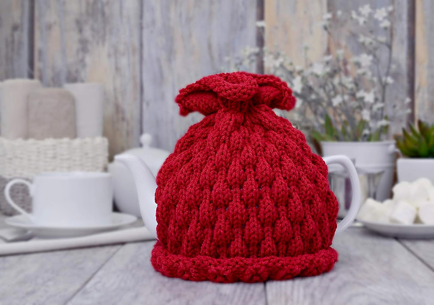 Red knitted teapot cozy