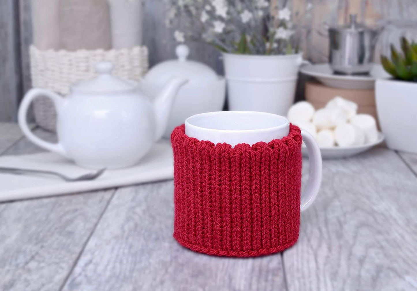 Red knitted mug cozy