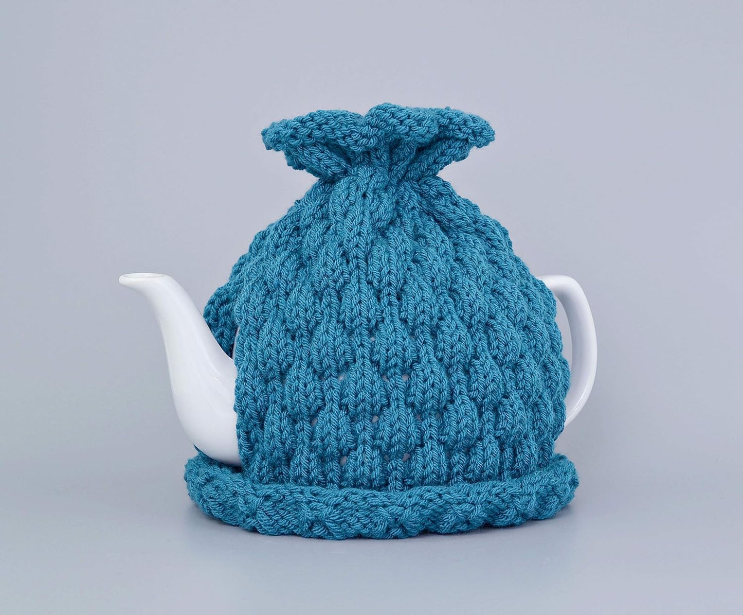 Teal knitted teapot cozy