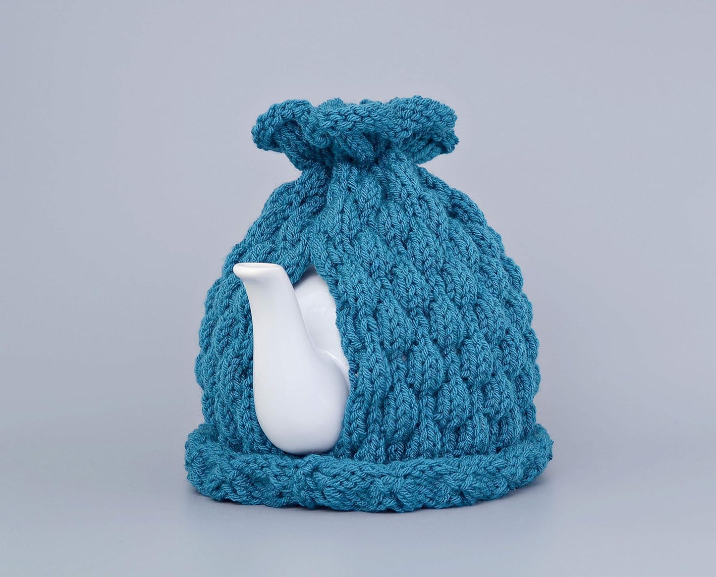 Teal knitted teapot cozy