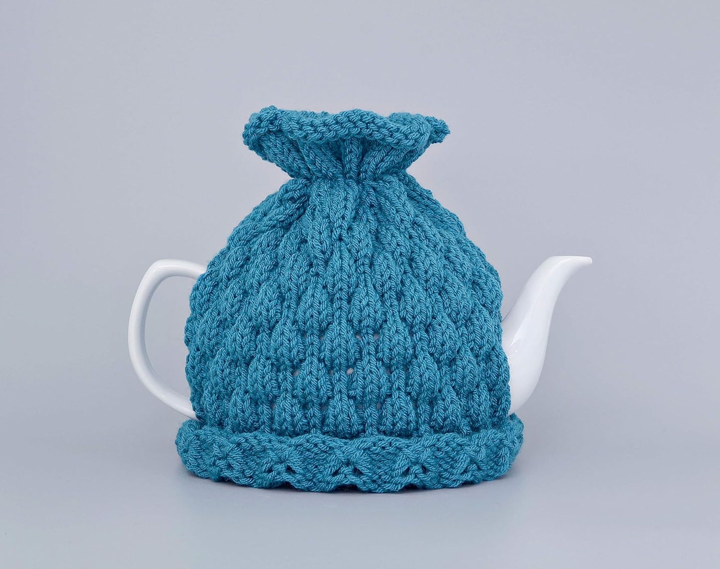 Teal knitted teapot cozy